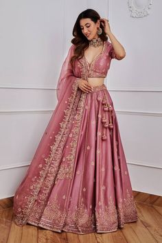 Aurora pink lehenga with gold dori, aari and sequin embroidery. Comes with half sleeves blouse and organza dupatta. Component: 3 Pattern: Embroidery Type Of Work: Sequin, Dori and Aari Neckline: Leaf Sleeve Type: Half Fabric: Chanderi and Organza; Lining: Satin Color: Pink Other Details:  Dupatta with scalloped embroidery border Tassels on the sides Note: Only selling the product mentioned in the description from the video. Occasion: Wedding - Aza Fashions Lehenga For Party Indian Weddings, Lehenga Look For Reception, Pink Lehenga Reception Look, Night Wedding Lehenga, Engagement Lengha Indian, Lengha Poses In Wedding, Wedding Dresses Lengha, Reception Lehenga Ideas, Pink Lehanga Ideas