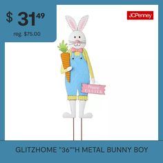 a large metal bunny holding a carrot and a sign that says, $ 31 99