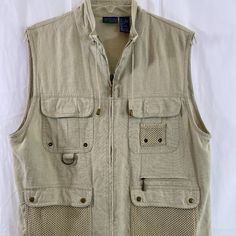 Country Club By Koret Beige Sleeveless Utility Vest Nwot Women's Size Medium Khaki Beige Utility Vest With Lots Of Zip, Velcro & Snap Closure Pockets. Drawstrings For Added Comfort And Full Zip Front. 55% Linen, 45% Rayon. Decor Is 100% Cotton. Machine Wash Cold Water Gentle Cycle And Tumble Dry Low Heat. Top Shoulder Seam To Bottom Hem 24" Bust 44" Waist 44" Hips 44" Safari Shirt Women, Tan Utility Vest, Summer Khaki Vest With Pockets, Sleeveless Outerwear For Spring Outdoor Activities, Sleeveless Spring Outerwear For Outdoor, Utility Sleeveless Vest For Summer, Summer Utility Sleeveless Vest, Casual Khaki Vest For Spring, Summer Sleeveless Utility Vest