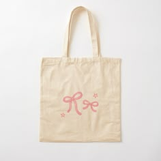 a pink tote bag with the letter k is for girl on it and stars