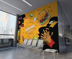 a wall mural in an office building with chairs and tables next to it that has a large burger advertisement on the wall