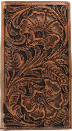 a leather wallet with an intricate design on the front and sides, made out of brown leather