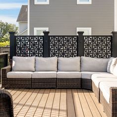 a couch and chair on a wooden deck