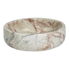 a white marble bowl sitting on top of a table