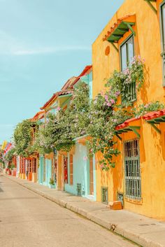 an empty street lined with brightly colored buildings