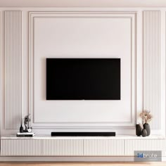 a flat screen tv mounted to the side of a white wall in a living room