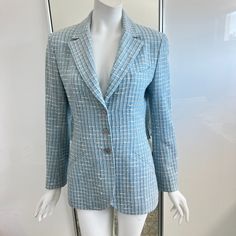 Beautiful Chanel Boutique Women's Jacket/Blazer In A Complex Light Blue Melange Tweed Boucle. There Are White, Black And Soft Pink Threads Infused Throughout. 1998 By Karl Lagerfeld. Made In France. Notched Lapels, Three Button Front Closure With Shoulder Pads And Long Sleeves. The Light Blue Lining Has The Cc Interlocking Logo Repeated Pattern Throughout. Buttons Also Have The Interlocking Cc Iconic Logos. There Is The Iconic Silver Chain Sewn Across The Bottom Hem. Chest Welt Pocket And Two Si Chanel Jackets, Repeated Pattern, Chanel Boutique, Tweed Suit, Chanel Jacket, Blue Tweed, Tweed Suits, Jacket Blazer, Karl Lagerfeld