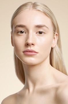 a woman with long blonde hair is posing for the camera and has her eyes closed