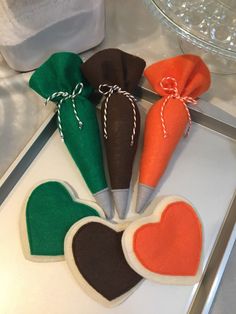 four carrots in the shape of hearts on a tray