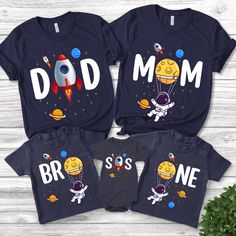 three matching shirts with the words dad, mom and son in space printed on them