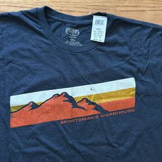 Short Sleeve T-Shirt Brand: Sportsman’s Warehouse Size: 3xl Approximate Measurements Length: 32 Inches Pit To Pit: 27 Inches Color: Navy Heather With Sunset Mountain Graphic Condition: New With Tags. No Flaws Or Stains. Material: 50% Cotton, 50% Polyester Stored In Smoke Free And Pet Free Home. Outdoor T Shirt Design, Beer Branding Design, Beer Branding, Mountain Graphic, Pink Floyd T Shirt, Simpsons T Shirt, White Crew Neck, Orange T Shirts, T Shirt Brand