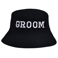 a black hat with the word groom printed on it's brimmed visor