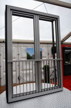 an open window on top of a metal table