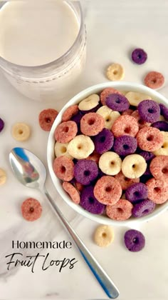 a bowl filled with cereal next to a glass of milk