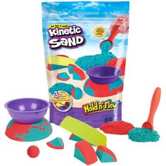 a bag of play - doh sand next to it's scoopers and spoons