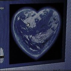 an image of a heart on a computer screen with the earth in the middle, as seen from space