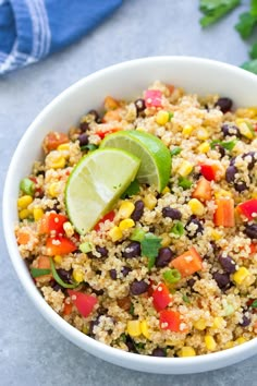 a white bowl filled with black beans, corn and cilantro