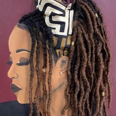 two mannequins with dreadlocks on their heads, one wearing a scarf