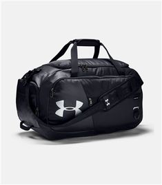 The UA Undeniable Duffle Bag is a roll-up garment bag that helps you for organized travel. It provides mesh ventilation that provides breathable storage options for your clothes. The large zippered openings to the main compartment can a full suit set and accommodate a dress. There are exterior straps with snap closures to secure the garment bag when rolled up. The top grab handle makes it easy to grab and go. It also has a front zippered pocket. It is convenient and durable. Small Duffle Bag, Luggage Store, Workout Essentials, Bag Essentials, Duffel Bags, Pierre Cardin, Perfect Bag, Herschel, Sport Bag