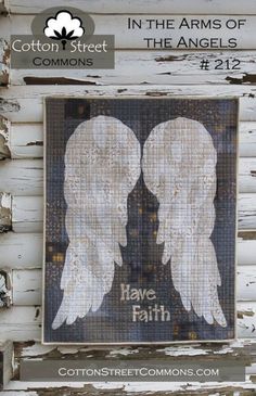 two white angel wings with the words have faith written on them in black and white