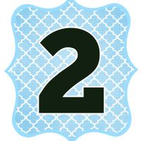 a blue and black number two sticker with the letter 2 in it's center