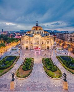 an aerial view of a large building in the evening