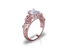 an engagement ring with roses on the side and a diamond center stone in the middle