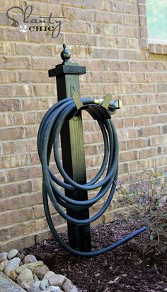 an outdoor garden hose holder for your garden