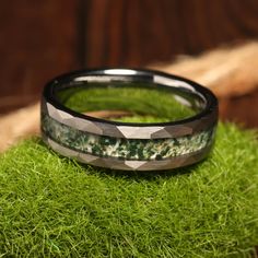 a close up of a ring on some grass