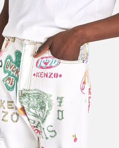 KENZO men's scribbled jeans in white. These denim pants feature allover scribbled graphics. There is a red logo patch at the right back pocket. Fresh Moodboard, Superman Supergirl, Graphic Pant, Logo Pants, Clothing Designs, Pocket Model, Red Logo, Pants Design