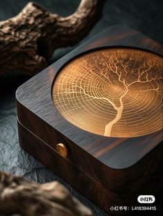 a wooden box with a tree etched on it