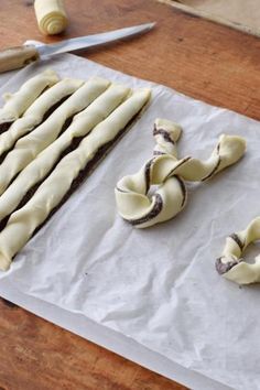 some food is laying out on a piece of paper next to a pair of scissors