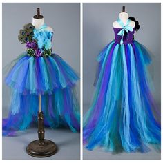 the dress is made out of tulle and has peacocks on it, as well as flowers