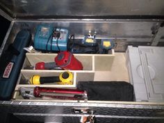 a toolbox with tools and other items in it