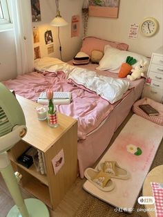 a bed room with a neatly made bed and an air conditioner on the floor