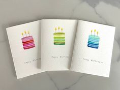 three cards with birthday candles on them