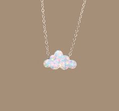 "Cloud necklace in silver, opal necklace, opal cloud jewelry, fire opal necklace, cute necklace, best friends necklace This super cute puffy opal cloud hangs peacefully from your choice of a sterling silver or 14k gold vermeil chain in the length of your choice!  This charm measures 7mmx12mm. More from BubuRuby? https://www.etsy.com/shop/BubuRuby?ref=hdr_shop_menu Looking for other charm necklaces? https://www.etsy.com/shop/BubuRuby?section_id=12318467 Raw crystal necklaces? https://www.etsy.com Necklaces Opal, Cloud Necklace Gold, Cloud Jewelry Necklaces, Opal Ocean Necklace, Cloud Jewelry, Raincloud Necklace, Necklace Best Friends, Best Friends Necklace, Cloud Necklace