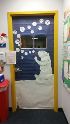 a classroom door decorated with polar bear and snowflakes