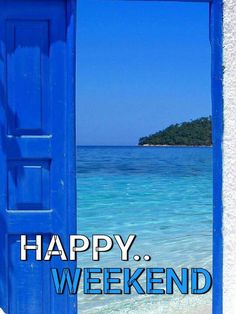 an open blue door with the words happy weekend on it in front of a beach