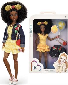 the doll is wearing a yellow dress and has an afro hairdow on her head