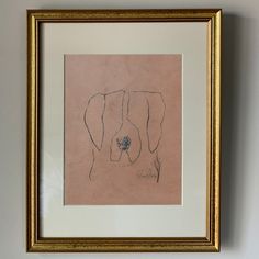 an elephant drawn on paper in a gold frame