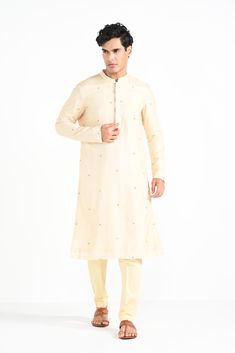 Rajasthani floral Hand embroidered nehru kurta set made in cream bamberg raw silk. Paired with cream slim fit Pant Pajama. Color of the actual garment may vary due to lighting conditions during the shoot.

Size Chart For Men





	
	
					Men's Size Chart
		

		
		
						
				Size Chart For Men
				Custom Size Measurement Guide
			
			
				
				
				Custom Size Measurement Guide
1. Take your measurements at ease…don’t hold your breath!
2. Be a little generous with the measurements. It’s always e Cream Cotton Silk Kurta With Resham Embroidery, Off White Cotton Silk Long Sleeve Kurta, Traditional Beige Kurta With Gota Work, Diwali Beige Kurta With Gota Work, Cream Chanderi Churidar With Straight Kurta, Beige Gota Work Kurta For Diwali, Off White Kurta With Gota Work For Eid, Beige Kurta With Gota Work For Eid, Diwali Beige Gota Work Kurta