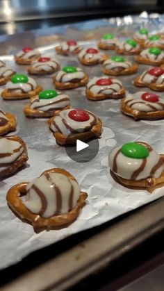 there are many decorated cookies on the baking sheet