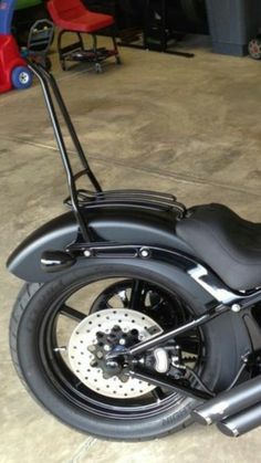 a black motorcycle parked in a garage