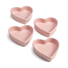 three heart shaped dishes sitting on top of each other