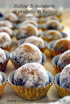 several muffins with powdered sugar on them