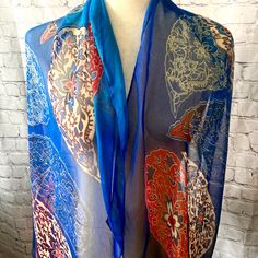 Beautiful, bright silk scarf in good vintage condition with no known issues.  Please examine pictures carefully before purchasing.  All items are sold as is. Blue Silk Scarf With Paisley Print, Vintage Silk Scarf For Festivals, Vintage Multicolor Paisley Scarves, Blue Paisley Print Bohemian Scarf, Blue Bohemian Paisley Print Scarves, Blue Bohemian Scarf With Paisley Print, Vintage Style Multicolor Silk Dupatta, Vintage Blue Scarf One Size, Blue Vintage Shawl Scarf