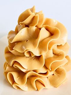 a pile of uncooked pasta sitting on top of a white plate