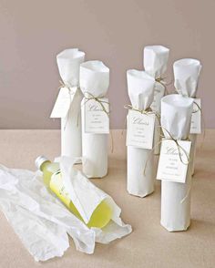 white wine bottles wrapped in paper and tied with twine