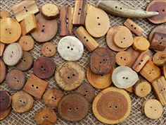 several wooden buttons are laying on a table